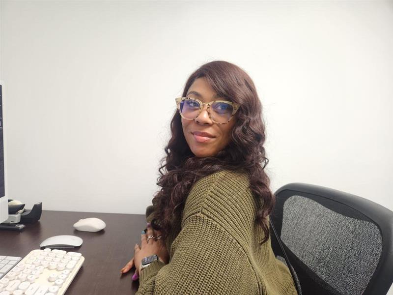 Pre-school Social Workers sits at her desk.